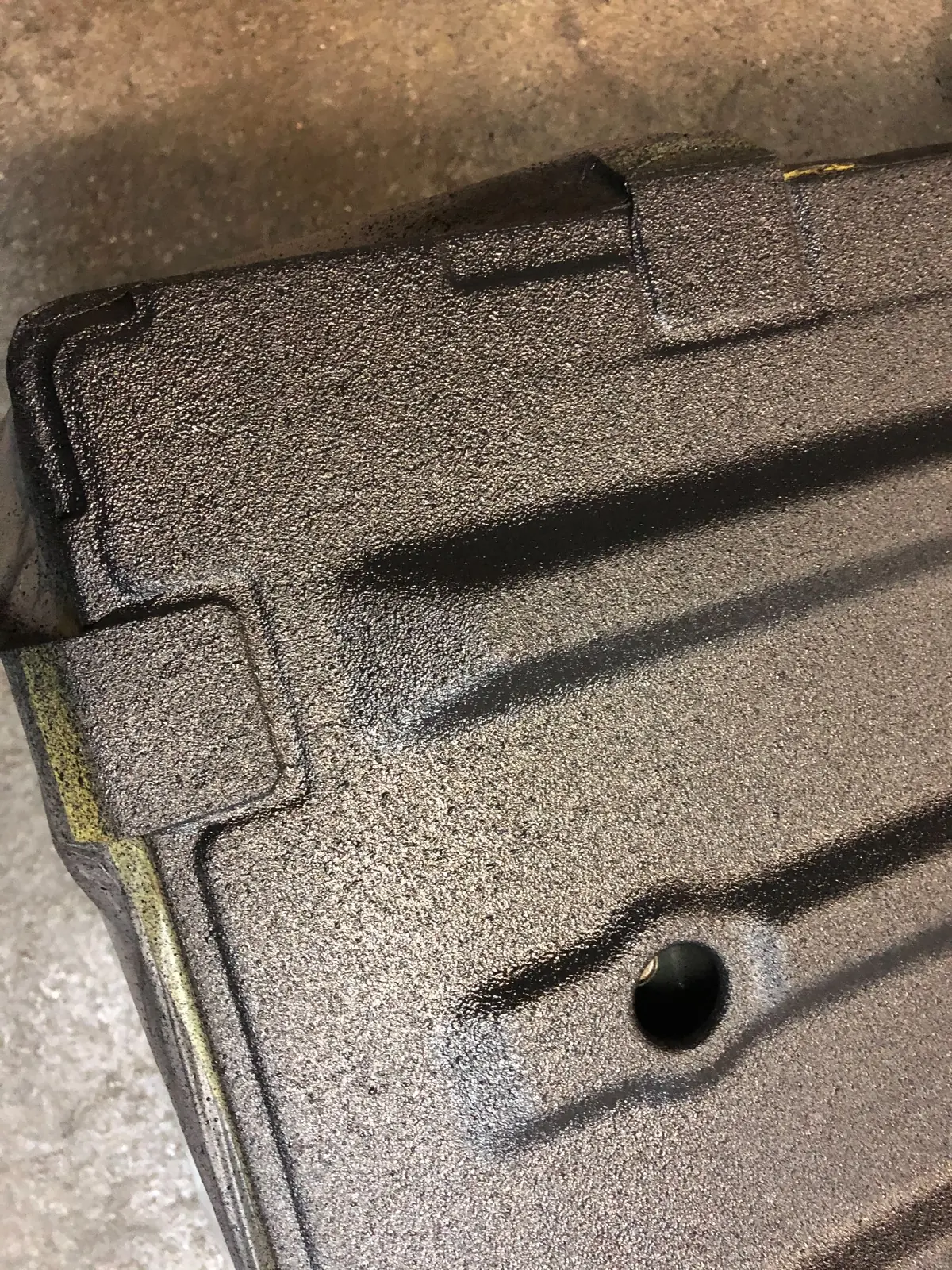 Close-up of the textured black RAPTOR coating on the Hijet Jumbo cargo bed